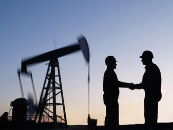 Merger Mania Hits the Energy Sector. Will This 8.9%-Yielding Dividend Stock Get Caught Up in the Current M&A Wave?: https://g.foolcdn.com/editorial/images/744517/the-silhouette-of-two-people-shaking-hands-near-an-oil-pump.jpg
