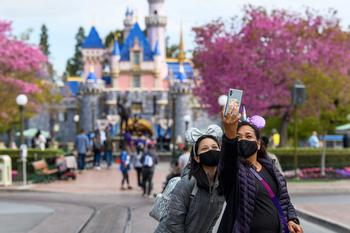 CEO Bob Iger's 3 Big Gambits Could Spell Trouble for Disney: https://g.foolcdn.com/editorial/images/743864/tourists-at-disneyland-taking-a-photo-in-front-of-sleeping-beauty-castle.jpg