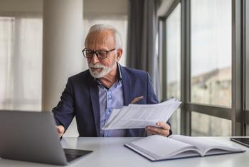Want the Max $4,873 Social Security Benefit in 2024? Here's the Salary You Need: https://g.foolcdn.com/editorial/images/762502/older-worker-holding-paper-and-looking-at-laptop.jpg
