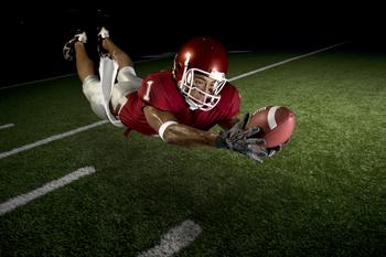 Why AT&T Stock Was a Winner Today: https://g.foolcdn.com/editorial/images/734208/football-player-making-a-diving-catch.jpg