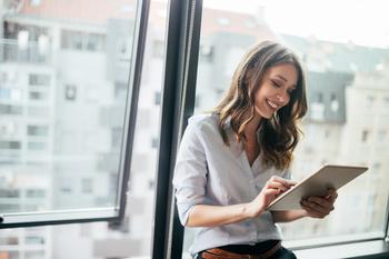 Is Now a Good Time to Buy Growth Stocks?: https://g.foolcdn.com/editorial/images/738602/gettyimages-casual-woman-executive_tablet_office.jpg