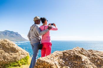 3 Little-Known Drawbacks of Retiring Abroad: https://g.foolcdn.com/editorial/images/767994/senior-couple-taking-photo-of-the-ocean.jpg