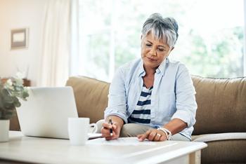 3 Tips for Choosing a New Part D Plan During Medicare Open Enrollment: https://g.foolcdn.com/editorial/images/750910/older-woman-laptop-holding-pen-gettyimages-902863756.jpg