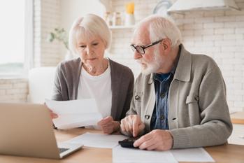 2 Social Security Changes That Could Help Beneficiaries Battle Inflation: https://g.foolcdn.com/editorial/images/703575/senior-couple-laptop-documents-gettyimages-1367867682.jpg