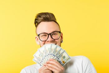 4 Ways to Grow $100,000 Into $1 Million for Retirement Savings: https://g.foolcdn.com/editorial/images/768981/getty-man-with-cash-money-dollars-dividends-happy.jpg