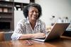 Want to Retire in 2024? Make These Moves Before 2023 Ends: https://g.foolcdn.com/editorial/images/751129/older-woman-laptop-smiling-gettyimages-1304406423.jpg