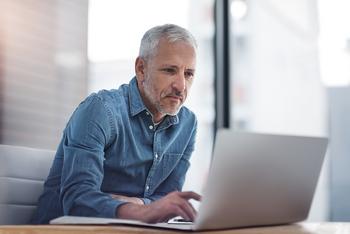 2 Stocks Up 40% or More in a Year That I'm Going to Keep Buying in the New Bull Market: https://g.foolcdn.com/editorial/images/762232/older-man-on-laptop-2022.jpg