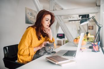 Why Chewy Stock Popped Then Dropped Today: https://g.foolcdn.com/editorial/images/782276/woman-looks-at-computer-with-cat-on-lap.jpg