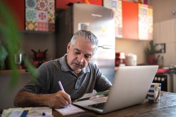 3 Reasons Retirement Might Cost More Than Expected: https://g.foolcdn.com/editorial/images/769776/senior-man-laptop-taking-notes-gettyimages-1278336166.jpg