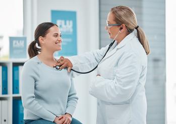 Want Growing Passive Income? Buy This Dow Jones Stock: https://g.foolcdn.com/editorial/images/721570/a-doctor-examines-a-patient-with-a-stethoscope.jpg