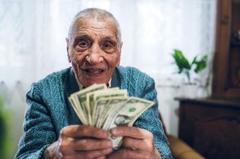 Who's Ready for a $192 Per Month Increase to Their Social Security Check?: https://g.foolcdn.com/editorial/images/691754/senior-man-counting-cash-money-bills-social-security-retire-invest-inflation-cola-getty.jpg