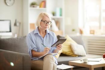 Before You Take Social Security, Answer This 1 Simple Question: https://g.foolcdn.com/editorial/images/717611/older-woman-sitting-on-a-couch-looking-at-a-calculator.jpg