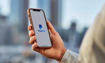 Going Bargain Hunting? PayPal Is the Best Beaten-Down Stock to Buy in 2024, but Only If You Believe 1 Thing.: https://g.foolcdn.com/editorial/images/766320/person-holding-phone-with-paypal-app-1_paypal.jpg