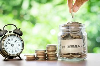 3 Sneaky Mistakes That Could Keep You From Retiring Early, and How to Avoid Them: https://g.foolcdn.com/editorial/images/759000/hand-putting-coins-in-glass-jar-with-retro-alarm-clock.jpg