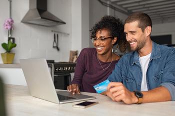 These 2 Stocks Helped the Dow Jones Industrials on Friday: https://g.foolcdn.com/editorial/images/718243/credit-card-gettyimages-1158244914-1.jpg