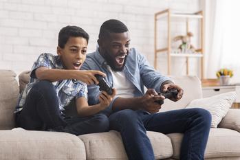2 Under-the-Radar Gaming Stocks You Can Buy and Hold for the Next Decade: https://g.foolcdn.com/editorial/images/754339/video-game-family-play-home-couch.jpg