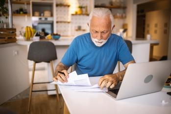 45% of Americans Say a Health Issue Upended Their Retirement. Do This to Avoid That Fate.: https://g.foolcdn.com/editorial/images/733104/senior-laptop-bills-gettyimages-1317757851.jpg