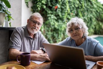 3 Lesser-Known Pitfalls of Required Minimum Distributions: https://g.foolcdn.com/editorial/images/773413/senior-couple-laptop-serious-gettyimages-1397343629.jpg