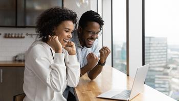 Better Artificial Intelligence Stock: Amazon vs. Microsoft: https://g.foolcdn.com/editorial/images/739204/smiling-couple-celebrates-good-news-on-the-computer.jpg