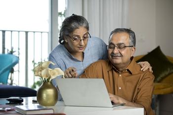 This Is the Average Social Security Benefit for Those Age 65: https://g.foolcdn.com/editorial/images/778554/senior-couple-laptop_gettyimages-1336702964.jpg