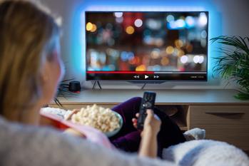 3 Reasons to Buy Netflix, and 1 Reason to Sell: https://g.foolcdn.com/editorial/images/734068/woman-streaming-on-tv-with-popcorn.jpg