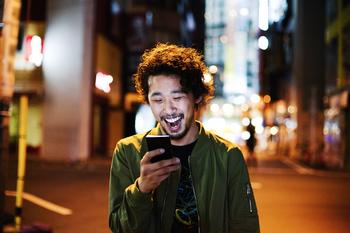 Have $500? 2 Unstoppable Growth Stocks to Buy Without Hesitation in the New Bull Market: https://g.foolcdn.com/editorial/images/777206/happy-young-man-with-smart-phone-at-night.jpg