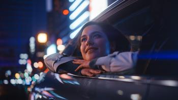 Should You Buy Toyota While It's Below $200?: https://g.foolcdn.com/editorial/images/787839/happy-person-leaning-out-of-a-car-window-while-riding-at-night.jpg