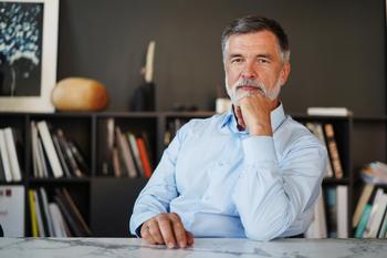 3 Pitfalls To Be Mindful Of If You're Retiring Early: https://g.foolcdn.com/editorial/images/763296/man-50s-desk-gettyimages-1366936744.jpg