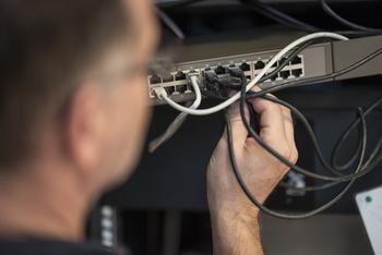 Comcast and Charter Have to Address This ... and Soon: https://g.foolcdn.com/editorial/images/718334/it-technician-removing-ethernet-cord-from-router.jpg