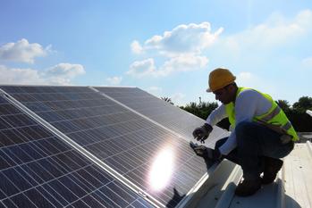 Why SunPower Stock Popped on Friday: https://g.foolcdn.com/editorial/images/779997/construction-worker-installing-rooftop-solar-panels.jpg