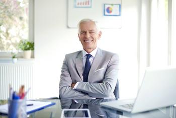 Most Businesses Have Experience With Phased Retirement. It Pays to Consider It for Your Senior Years.: https://g.foolcdn.com/editorial/images/766101/older-man-suit-smiling-gettyimages-1277752450-1.jpg