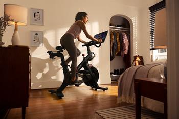 Peloton's Restructuring Is Complete. Is It Time to Buy the Stock?: https://g.foolcdn.com/editorial/images/704013/a-person-using-their-peloton-exercise-bike-in-their-bedroom.jpg