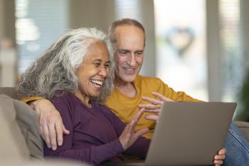 Here's How Investing $50 Per Week Can Generate $35,000 in Annual Dividend Income by Retirement: https://g.foolcdn.com/editorial/images/779308/senior-couple-looking-at-a-laptop.jpg