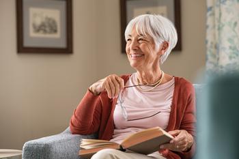 Social Security: 3 Easy Ways to Get More Benefits: https://g.foolcdn.com/editorial/images/748571/senior-woman-smiling-book-gettyimages-1316201778.jpg