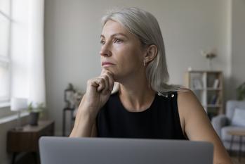 Doing These 3 Things Could Result in a Lower Social Security Benefit for Life: https://g.foolcdn.com/editorial/images/756609/older-woman-laptop-thoughtful-gettyimages-1578882963.jpg