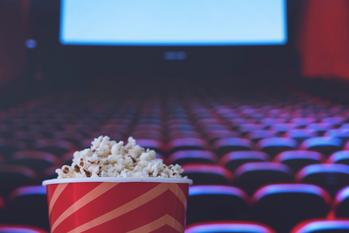 Why Warner Bros. Discovery Stock Was Bouncing Back Today: https://g.foolcdn.com/editorial/images/693400/bucket-of-popcorn-in-the-foregound-of-a-movie-theater.jpg