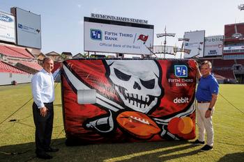  Fifth Third Bank Launches the New Tampa Bay Buccaneers Debit Card: https://mms.businesswire.com/media/20220727005195/en/1525340/5/Fifth_Third_Bank_Regional_President_Cary_Putrino_and_Bucs_COO_Brian_Ford_unveil_new_Bucs_branded_debit_card1.jpg