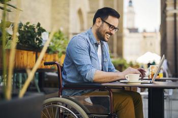 A Bull Market Is Coming: Is It Time to Revamp Your Portfolio?: https://g.foolcdn.com/editorial/images/747240/happy-wheelchair-person-working.jpg