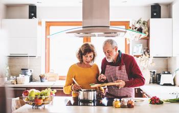 Social Security: 3 Ways to Get More Spousal Benefits: https://g.foolcdn.com/editorial/images/773845/retired-couple-cooking-home-food.jpg