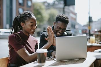 What Visa's Earnings Show About The Economy: https://g.foolcdn.com/editorial/images/718242/couple-high-five-in-front-of-laptop.jpg