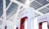 Tesla: Buy, Sell, or Hold?: https://g.foolcdn.com/editorial/images/763938/group-of-tesla-super-chargers-with-logo-in-view.png