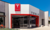 Why I Am Increasingly Optimistic About Tesla (Cautiously): https://g.foolcdn.com/editorial/images/790848/tesla-sales-center-with-tesla-logo-on-building-for-tesla-sales.png