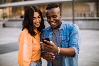 The Secret to Maxing Out Your Roth IRA in 2023: https://g.foolcdn.com/editorial/images/717386/happy-couple-outdoors-staring-at-phone.jpg