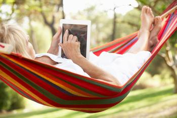 Planning to Retire in 2028? Take These Steps Before You Leave Your Job: https://g.foolcdn.com/editorial/images/745327/senior-woman-relaxing-in-hammock-reading-ebook.jpg