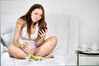 Why Hanesbrands Stock Dove by 8% on Thursday: https://g.foolcdn.com/editorial/images/765607/person-in-undershirt-using-a-smartphone-in-bed.jpg