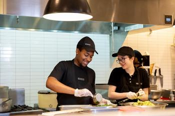 Chipotle Stock Still Has Big Upside According to 1 Wall Street Analyst. Is the Stock a Buy at an All-Time High After Its High-Profile Stock Split Announcement?: https://g.foolcdn.com/editorial/images/770008/two-smiling-chipotle-workers-preparing-food.jpg
