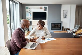 What Does a Recession Mean for Your Retirement?: https://g.foolcdn.com/editorial/images/692750/two-people-sitting-at-a-table-looking-at-documents.jpg
