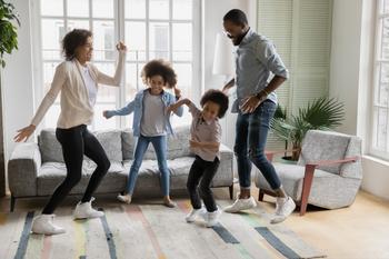 1 Beaten-Down Stock to Buy and 1 to Avoid: https://g.foolcdn.com/editorial/images/738281/family-dancing-happy-financial-planning-children-couple.jpg