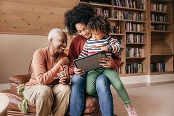 These 4 Investment Types Are the Simplest to Pass On to Your Heirs. These 4, Not So Much.: https://g.foolcdn.com/editorial/images/733360/parent-grandparent-child-looking-at-a-tablet-smiling-family.jpg