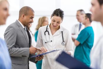 Is This Healthcare Stock a Screaming Buy After Scoring a Huge Drug Approval?: https://g.foolcdn.com/editorial/images/770399/a-doctor-looking-at-a-tablet-with-another-person.jpg